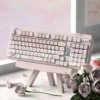 A charming angle of the adorable Greedy Pig PBT dye-sub keycap set, displaying various food-inspired cartoon characters in vibrant, soft colors.