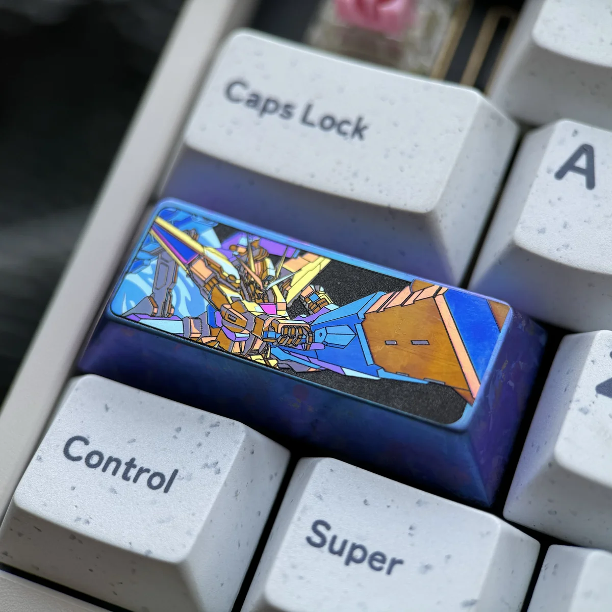 A premium Gundam Titanium Keycap, 2.25U Mecha Spirit, crafted from vibrant anodized titanium alloy, showcasing its intricate industrial sci-fi design.