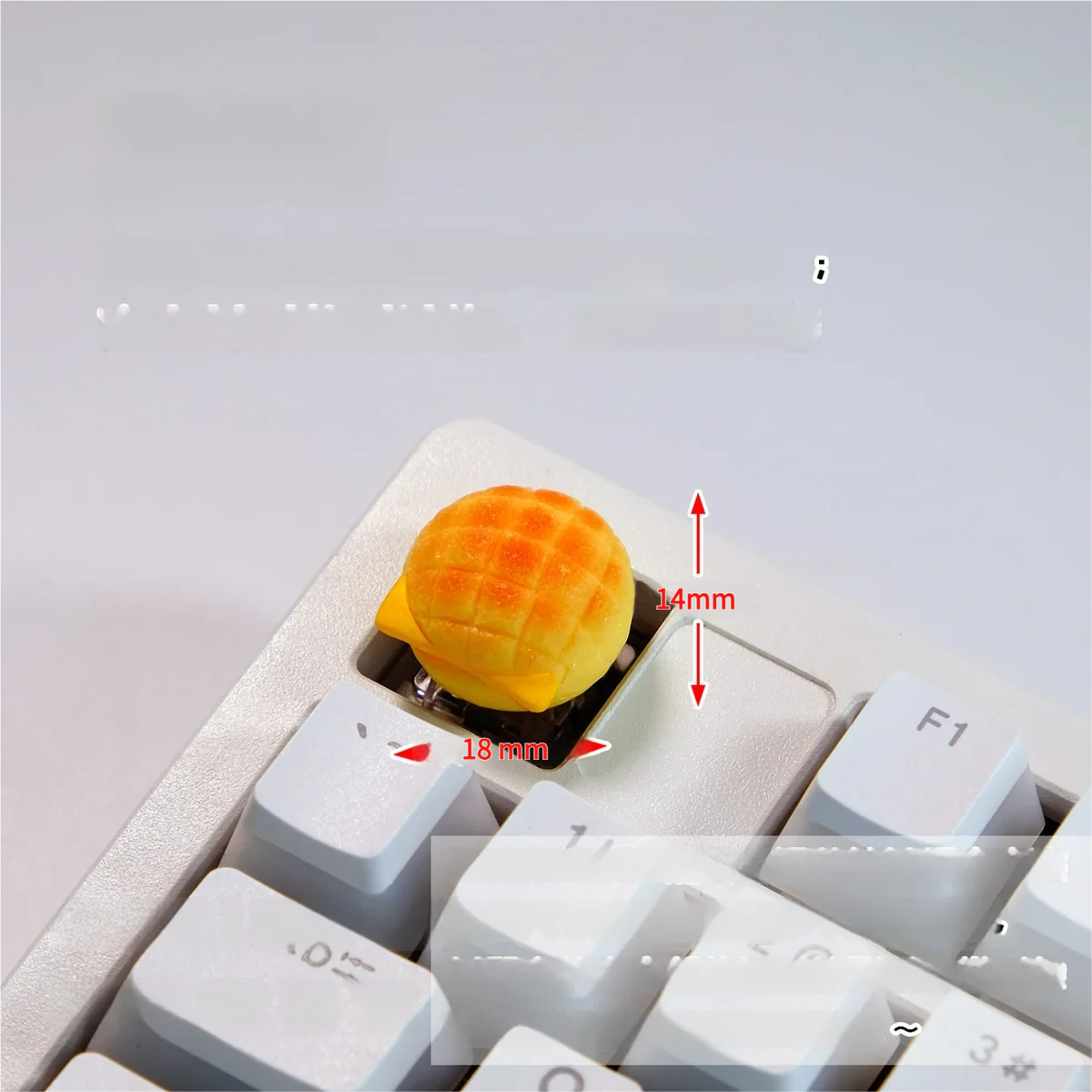 Handcrafted whimsical pineapple bun artisan keycap, featuring realistic golden-brown textures for a delectable, playful keyboard aesthetic.