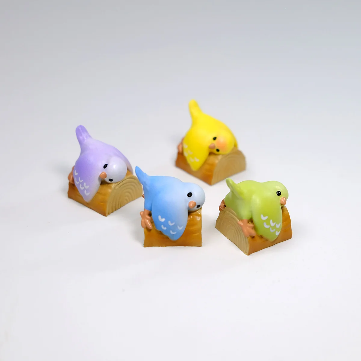 Artistic handcrafted 3D artisan Parrot Hugging Stump keycap, a whimsical miniature scene featuring a colorful parrot, blooming peony, and textured wooden stump.