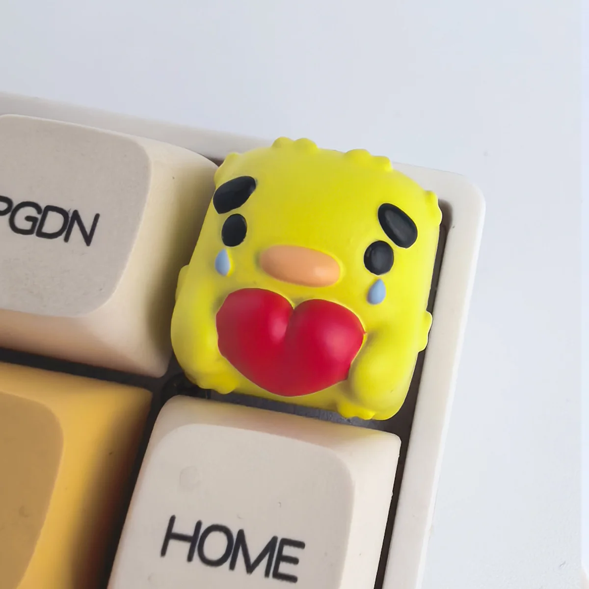 A collection of handcrafted resin animal artisan keycaps displayed from multiple angles, showcasing their whimsical designs, vibrant colors, and intricate design.