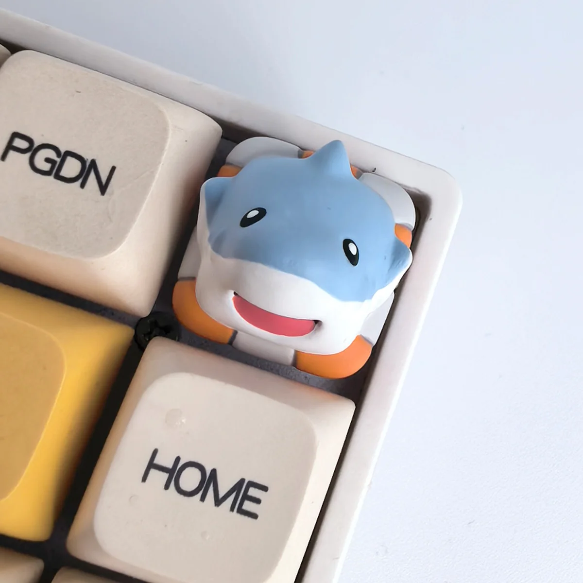 A whimsical handcrafted resin animal artisan keycap depicting a detailed shark, bringing playful charm and artistry to your keyboard.