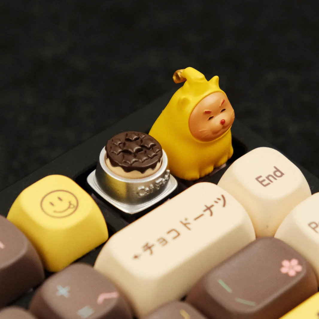 Close-up views of the whimsical Twinkle Twinkle Cat & Bowl Keycaps, showcasing its vibrant handcrafted details and imaginative design from multiple angles.