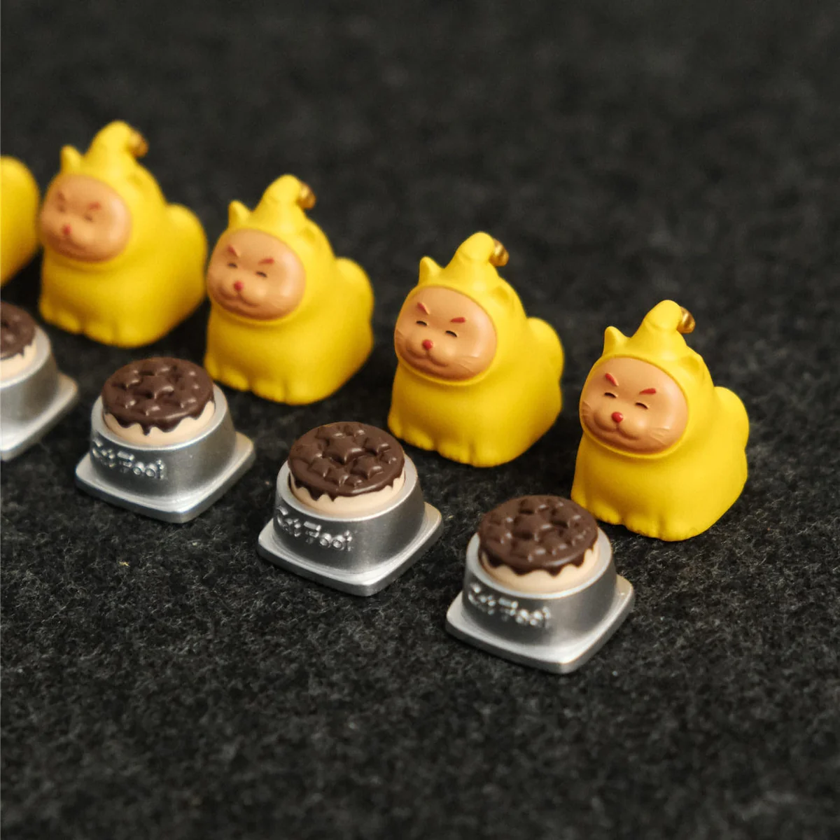 A gallery of the whimsical Twinkle Twinkle Cat & Bowl Keycaps, showcasing its handcrafted quality, vibrant colors, and unique playful design from various angles.