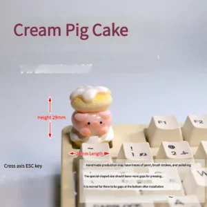 Adorable 3D handmade pig keycap. Custom sculpted whimsical pastel piggy, dessert-inspired. Detailed view of this charming artisan keycap.