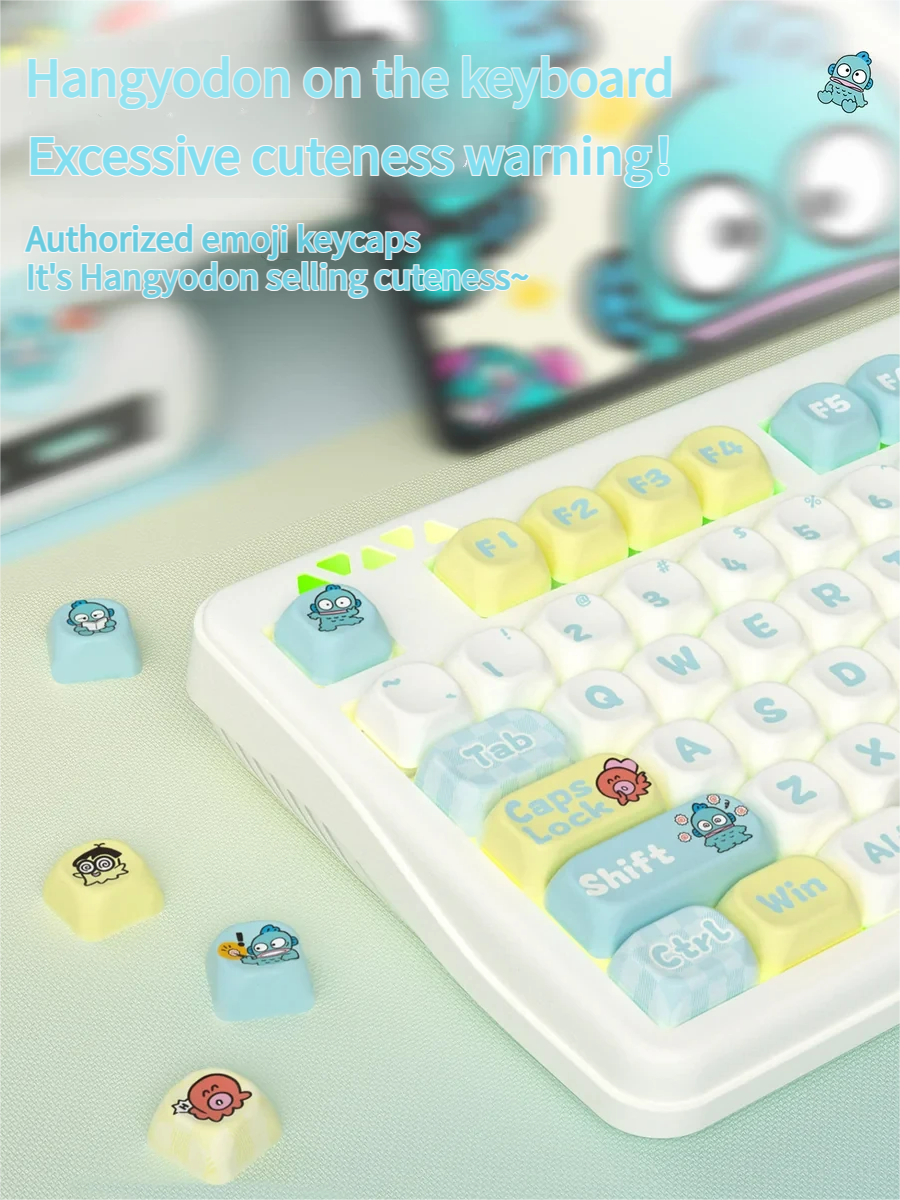 Close-up of the exclusive Hangyodon Clownfish PBT keycap set, showcasing vibrant oceanic hues and playful character art from multiple angles.
