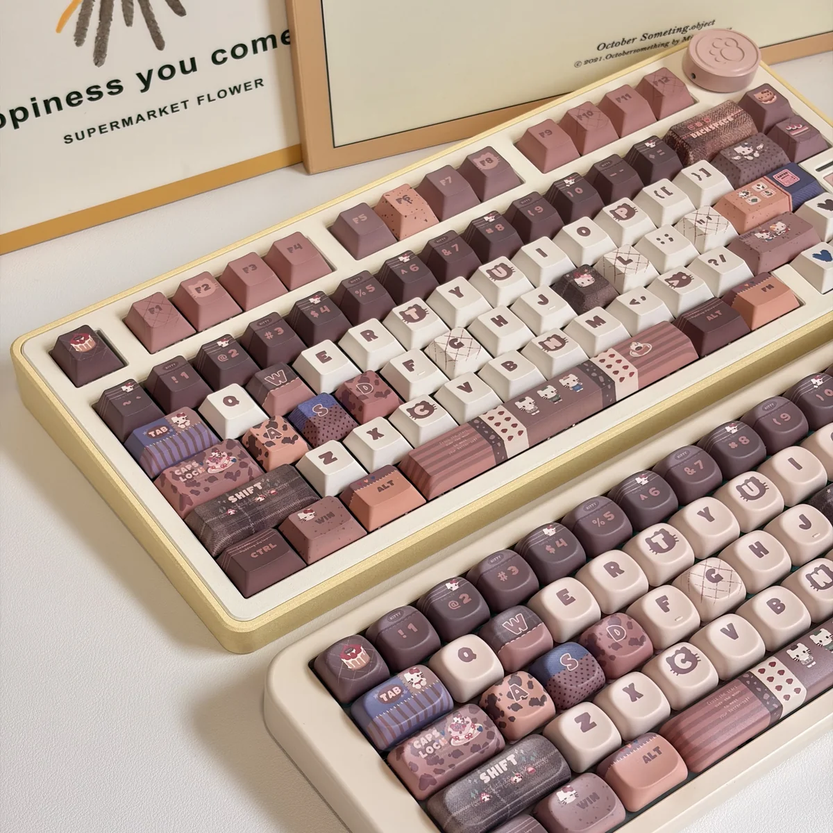 Exclusive Hello Kitty Mont Blanc dessert keycaps set shown from various playful angles, featuring warm creamy browns, whites, and charming Hello Kitty motifs.