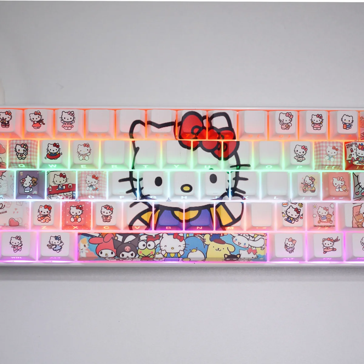 Close-up of vibrant Hello Kitty side-engraved backlit keycaps set from multiple angles, showcasing charming graphics and colorful RGB glow.