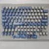 Vibrant Bocchi the Rock backlit keycaps set from an appealing angle, highlighting the glowing four-sided anime character art for keyboard enthusiasts.