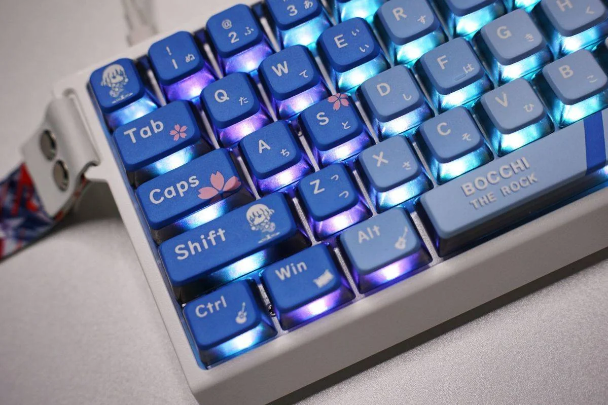 Vibrant Bocchi the Rock! Hitori Gotoh four-sided backlit keycaps set, showcasing playful anime art with glowing translucent effects for a 119-key keyboard.