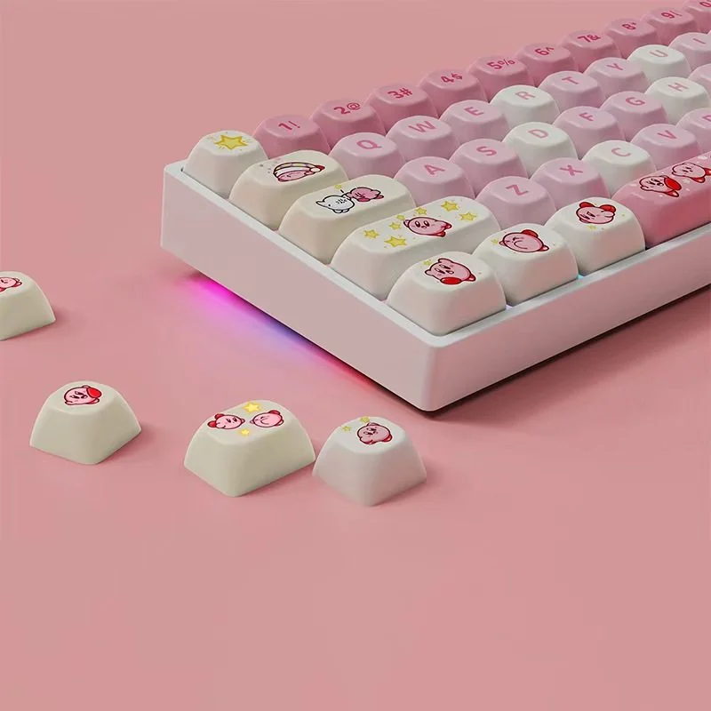 Vibrant Kirby Keycaps custom set crafted from durable PBT, showcasing the ergonomic MOA profile and whimsical character art from multiple playful angles.