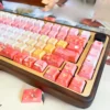 Close-up of Autumn Maple PBT keycaps set, showcasing exquisite traditional art and vibrant autumnal hues designed for backlight glow.