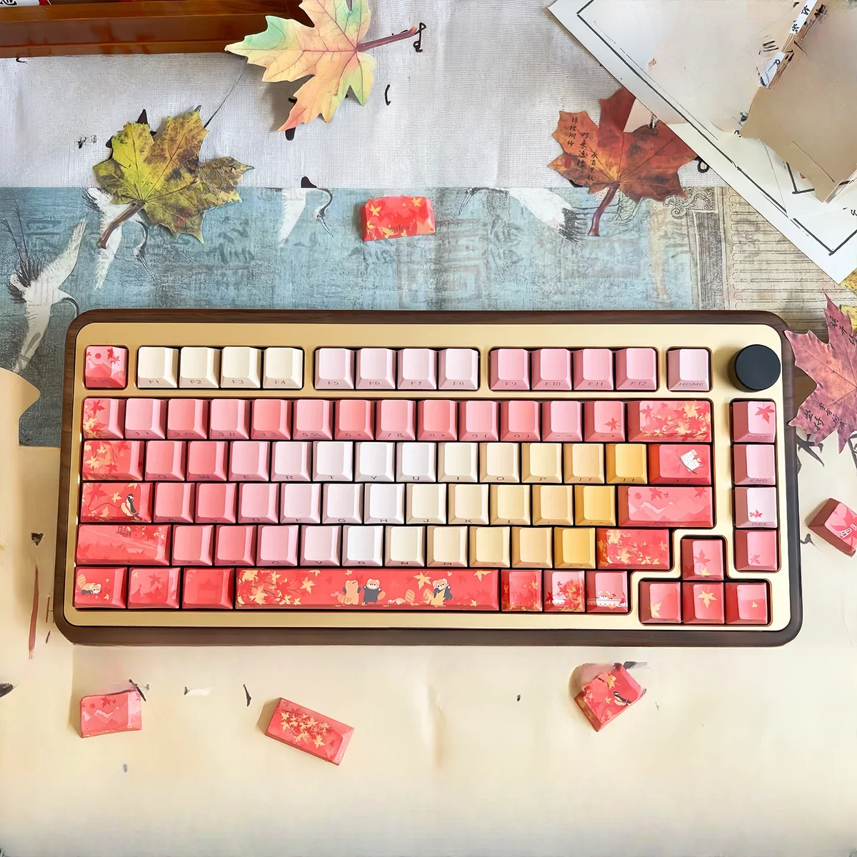 Close-up of an Autumn Maple PBT keycap set, revealing vibrant red hues and exquisite traditional art details.