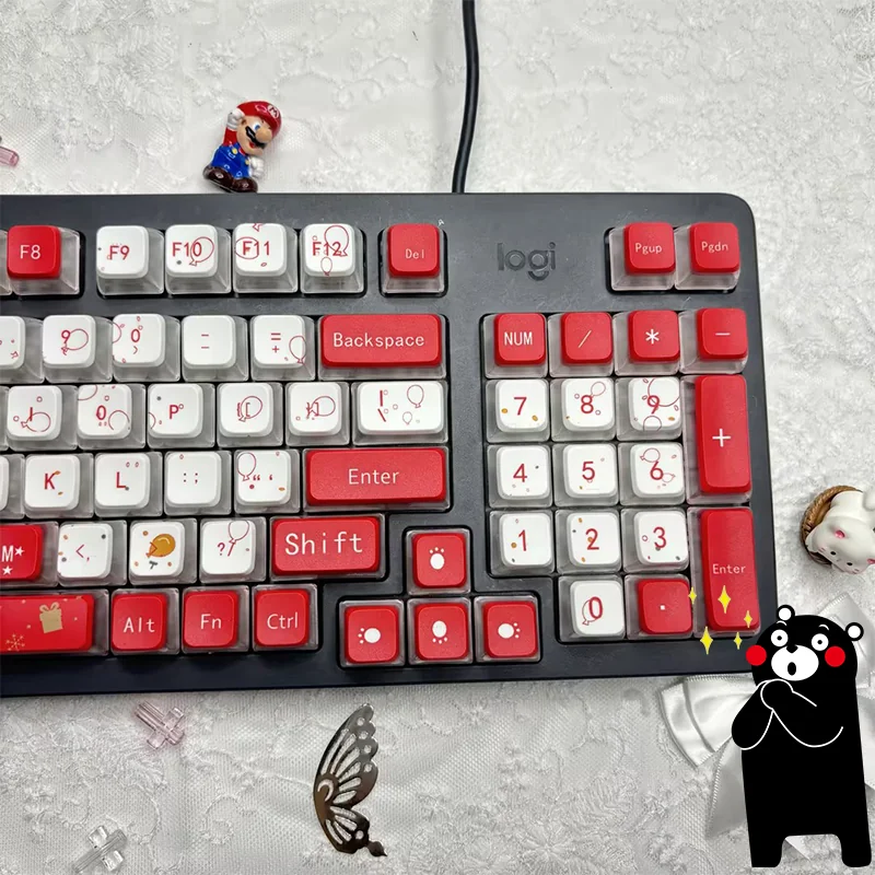 Close-up gallery views of playful Kumamon Christmas keycaps set, highlighting vibrant festive designs and brilliant four-sided RGB translucent PBT.
