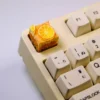 Detailed gallery views of the whimsical handcrafted lemon toast cake artisan keycap, showcasing its charming miniature design and edible-looking texture.