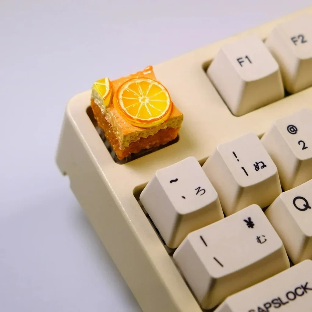 Detailed gallery views of the whimsical handcrafted lemon toast cake artisan keycap, showcasing its charming miniature design and edible-looking texture.