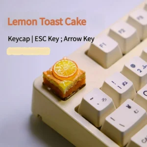 Whimsical handcrafted lemon toast cake artisan keycap, a charming miniature food art piece for keyboards.