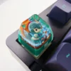 Multiple angles of the handcrafted Hwei LoL artisan keycap, showcasing its vibrant, translucent resin design and meticulous character sculpting.