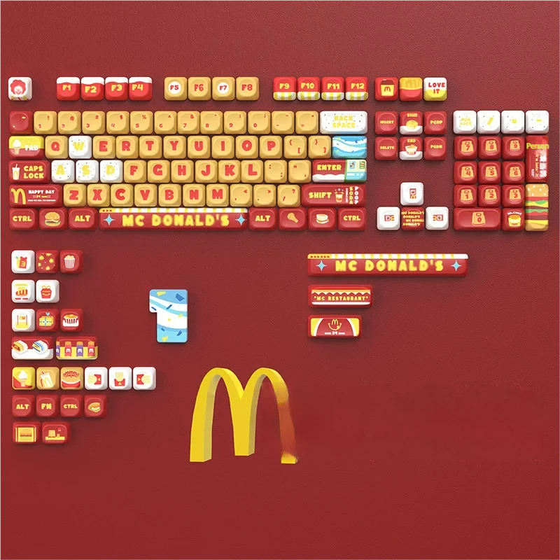 McDonald's keycaps set: a playful PBT MOA set in vibrant red, yellow, and white, showcasing iconic fast-food imagery and the golden arches for a fun keyboard.