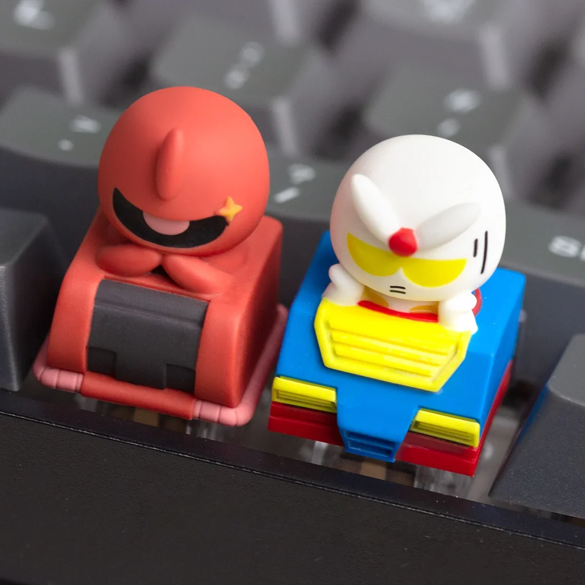 A collection of detailed views showcasing the handcrafted Chibi Character resin keycap, highlighting its vibrant, stylized mecha art from multiple angles.