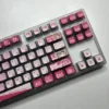Exclusive MyGO Chihaya Anon glowing PBT keycaps set, translucent and vibrant with dynamic anime art, shown from multiple playful angles.