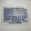 MyGO Tomori translucent PBT keycaps set, anime-themed. Various angles showcase four-sided luminescence, melancholic artistry, and radiant RGB.