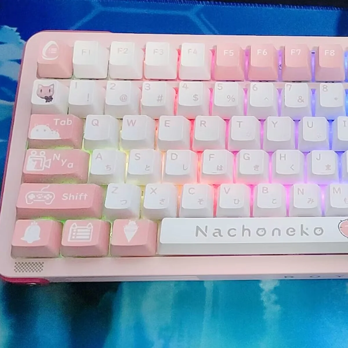 Nachoneko PBT anime keycaps set from multiple angles, highlighting dreamy pastel pink, purple, blue, and kawaii cat girl illustrations with stars.