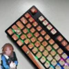 Close-up gallery views of Nagasaki Soyo PBT four-sided shine-through keycaps set, showcasing vibrant anime art and dynamic RGB light from various angles.