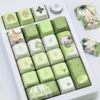 Dynamic shot of the exclusive Genshin Impact Nahida MDA profile keycaps set, revealing their vibrant character art and whimsical details from a distinct angles.