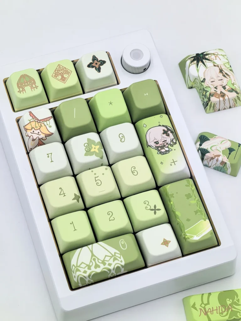 Dynamic shot of the exclusive Genshin Impact Nahida MDA profile keycaps set, revealing their vibrant character art and whimsical details from a distinct angles.