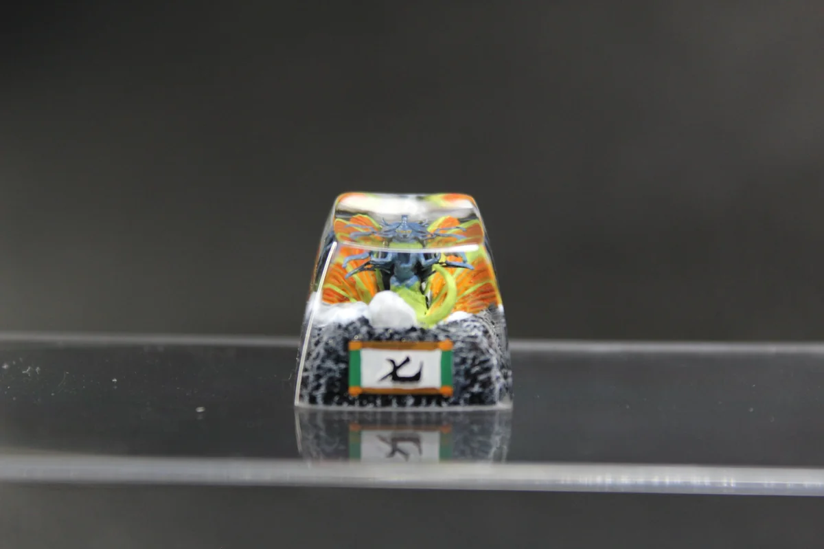 Multiple angles of the handcrafted Chomei's Spirit Naruto artisan resin keycap, showcasing its vibrant, intricate Tailed Beast sculpture and unique art.