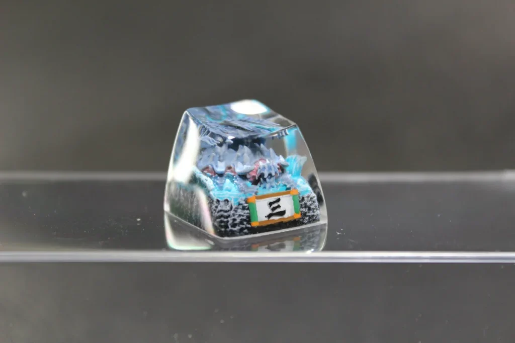 Artistic handcrafted Naruto Isobu Keycap showcasing an ethereal sky-blue Tailed Beast within intricate resin art.
