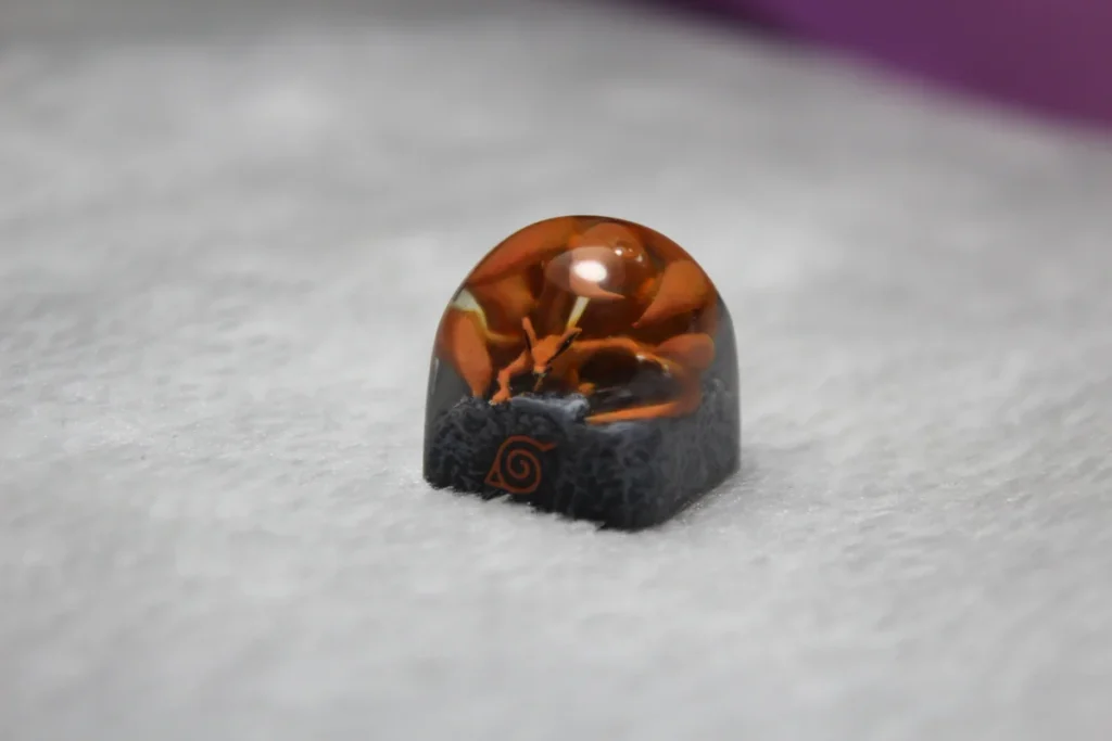 Exquisite handcrafted Naruto Kurama artisan keycap showcasing the dynamic Nine-Tails in fierce anime power art.
