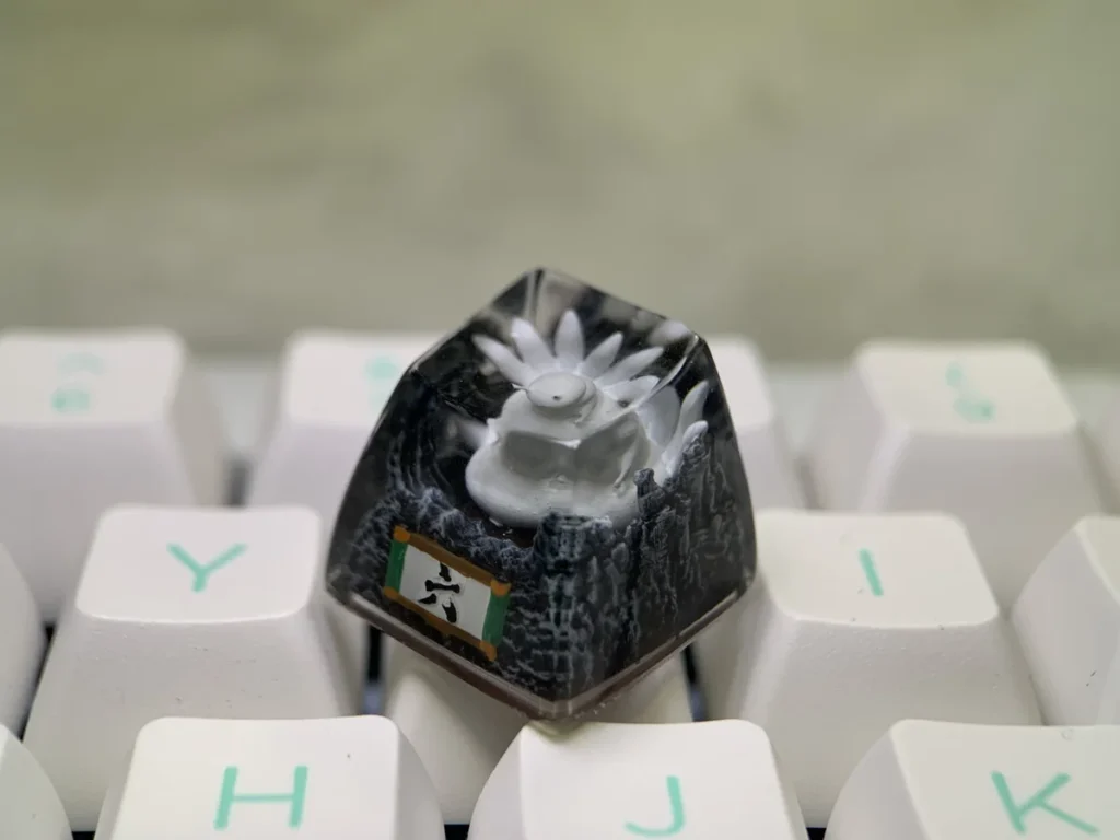 Exquisite handcrafted Naruto Six-Tails Saiken artisan keycap, showcasing intricate sculptural details and vibrant colors for a fierce spirit.