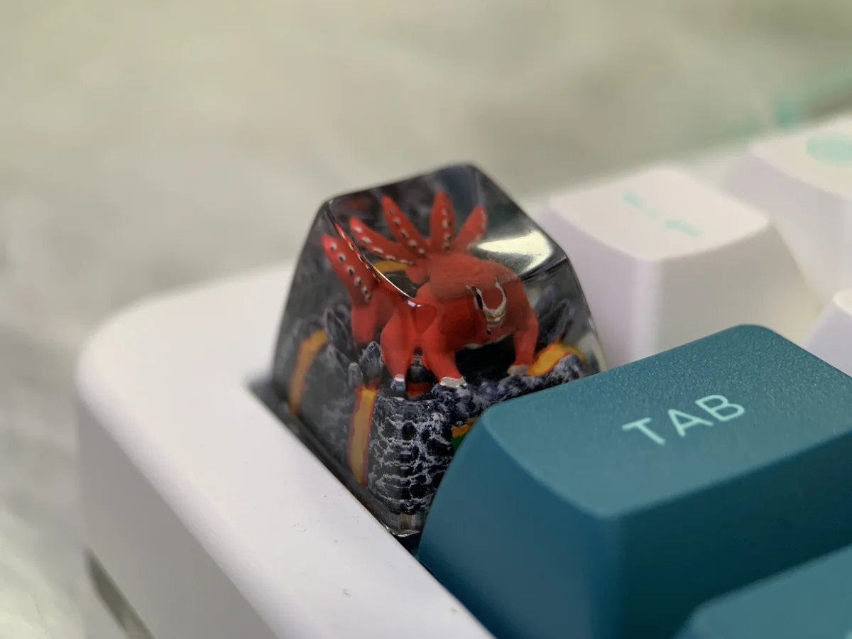 Handcrafted Naruto Four-Tails resin keycap, shown from various angles. Features vibrant red, powerful beast, and intricate anime details.