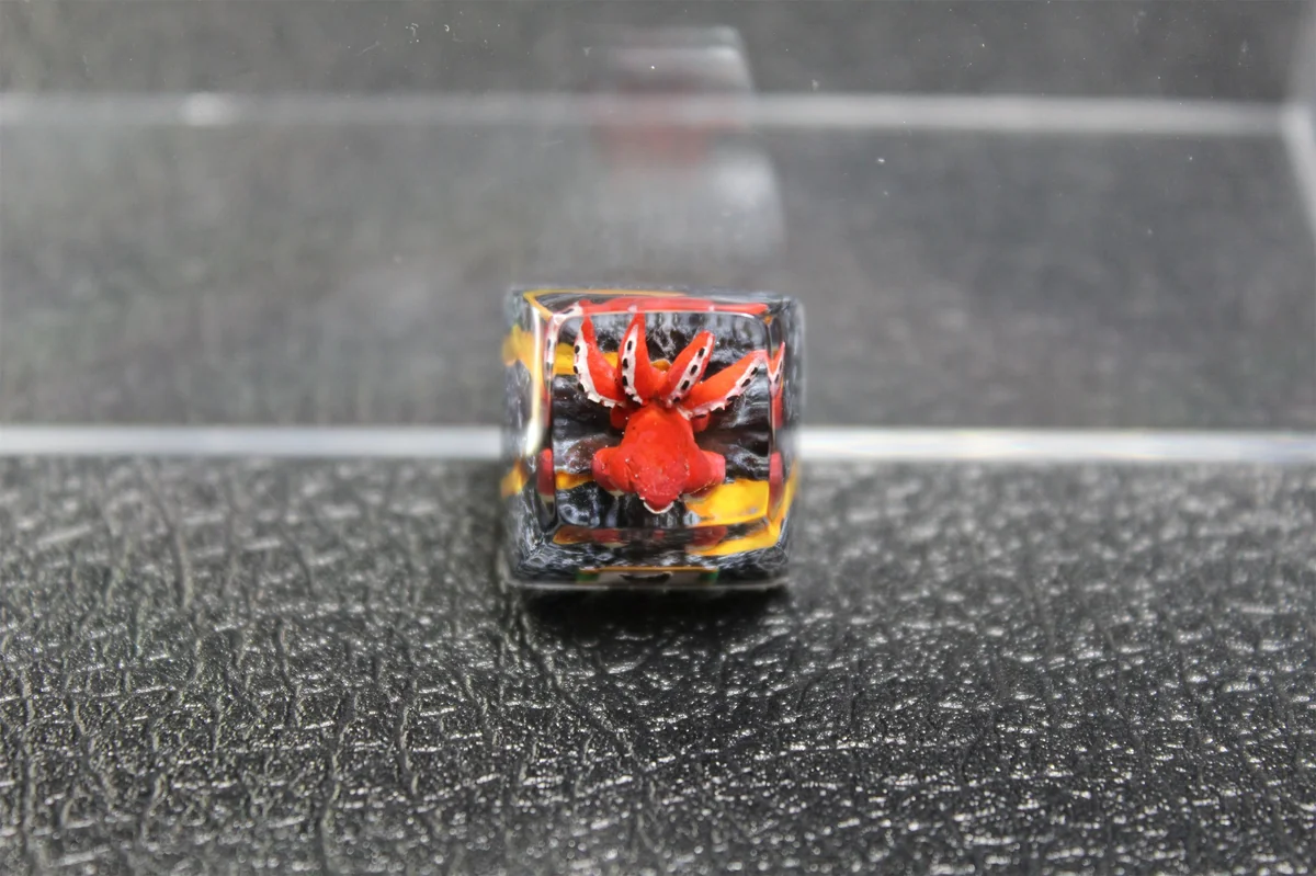 Handcrafted Naruto Four-Tails resin keycap gallery showcasing vibrant red details, powerful beast design, and intricate artistry from multiple angles.