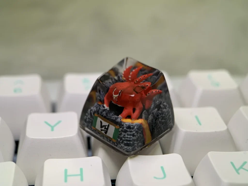 Vibrant red handcrafted Naruto Four-Tails resin keycap showcasing intricate details and a powerful anime aesthetic.