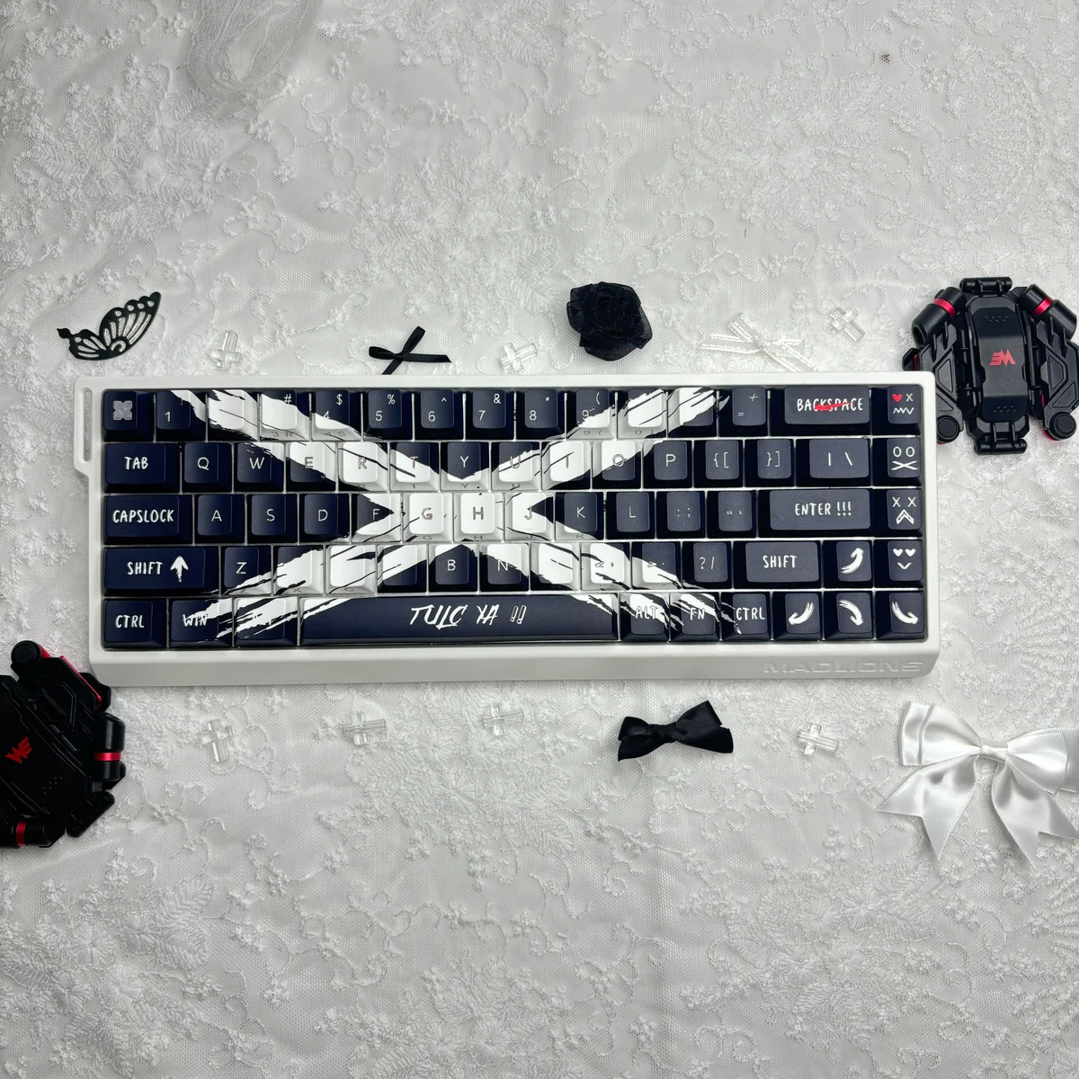 A striking black and white 73-key set of Objection Overruled keycaps set featuring bold, minimalist side-engraved Cherry legends.