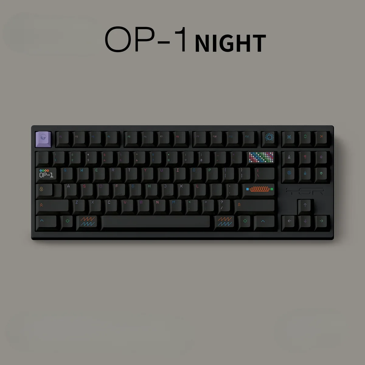Angled view of the pure black OP-1 Night PBT keycaps set, showcasing their sleek, iconic minimalist design, durable PBT construction, and crisp, legible legends