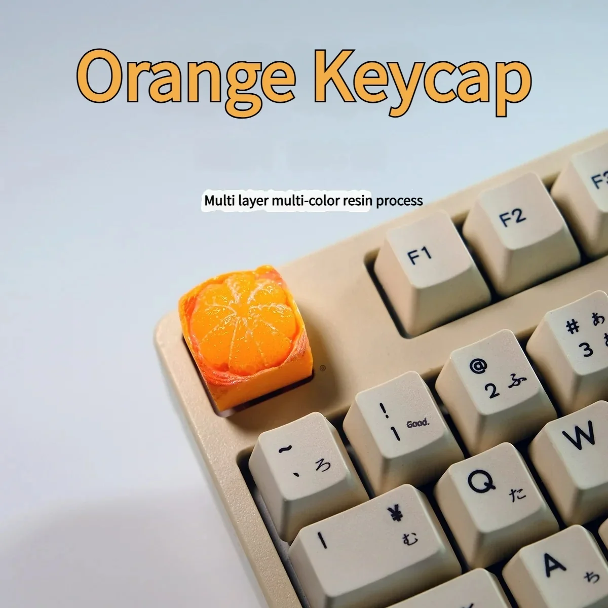 Playful handcrafted orange artisan keycap for keyboards, sculpted like a tiny, vibrant orange fruit.