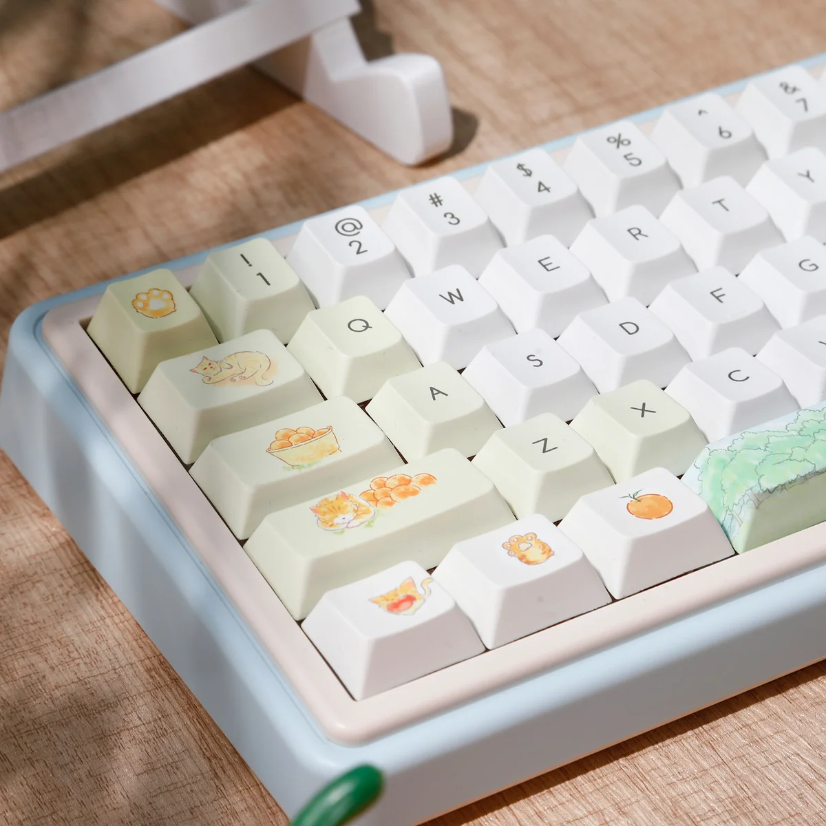 Whimsical Summer Orange Cat PBT Keycap Set, displaying multiple angles of the playful orange cat designs and soft summer pastel hues.