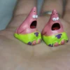 Whimsical handmade pink Patrick Star resin artisan keycap, showcased from various angles to highlight its playful details.