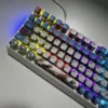 Playful vibrant RGB PBT MyGO Band Theme keycap set from multiple angles, showcasing their translucent design, comfortable MDA profile, and immersive backlighting design.