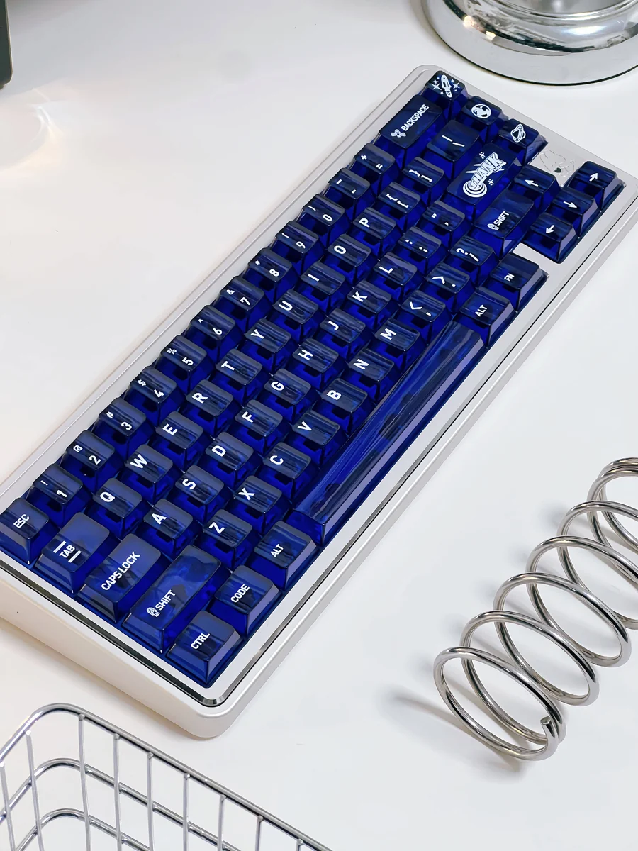 Striking Acid Blue White PC translucent keycaps set, 120-key Cherry profile. Vibrant blue transparent and white keys illuminate custom setups.