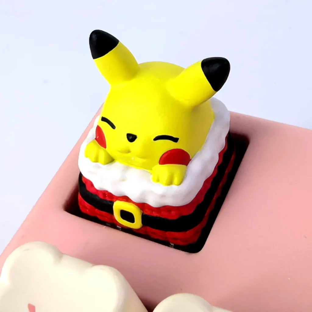 Festive, handcrafted 3D resin Pikachu keycap, sculpted with playful charm. Displayed from various angles for keyboards.