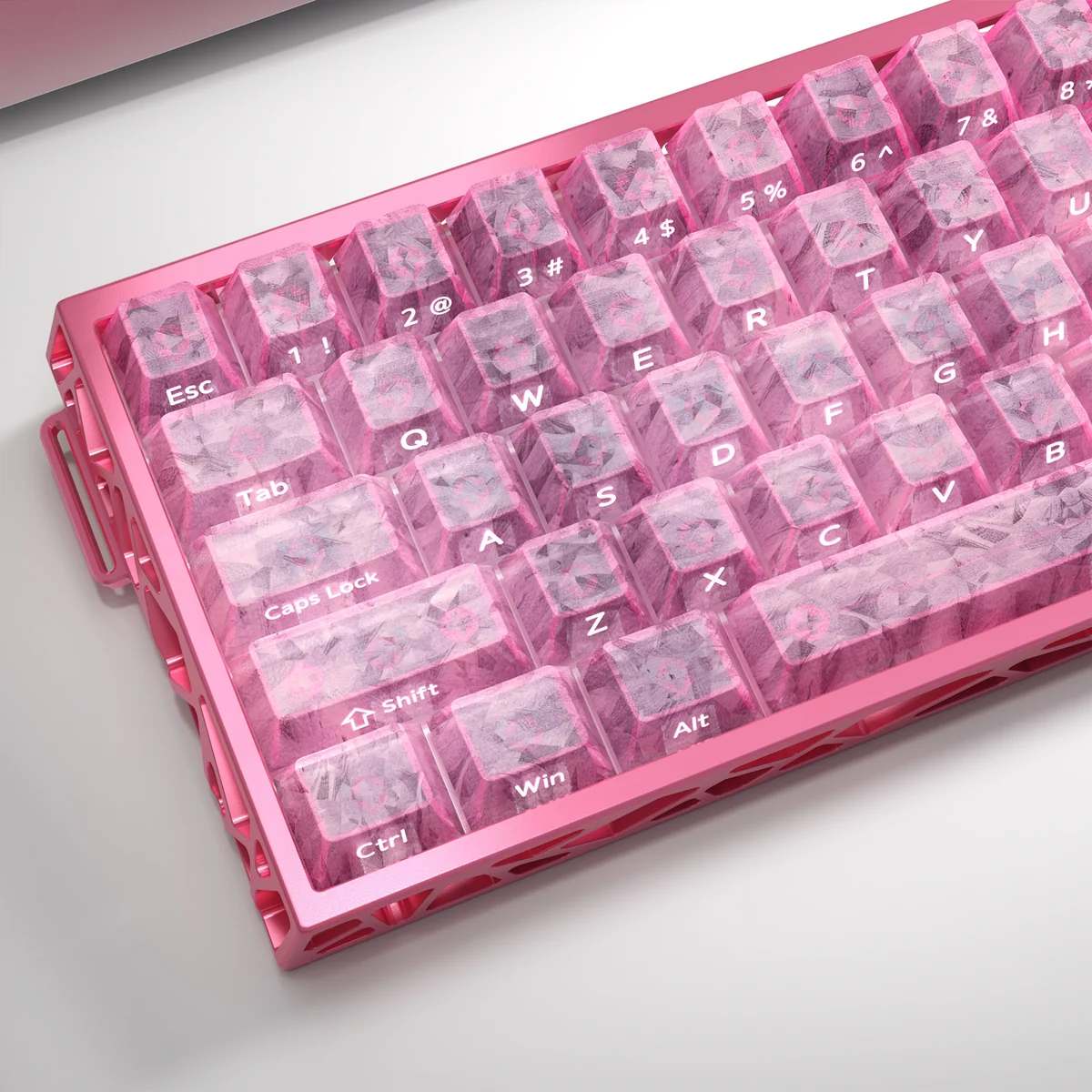 A gallery view of Pink Forged Carbon Keycaps set from various angles, showcasing their distinctive, high-tech texture and vibrant pink elegance.