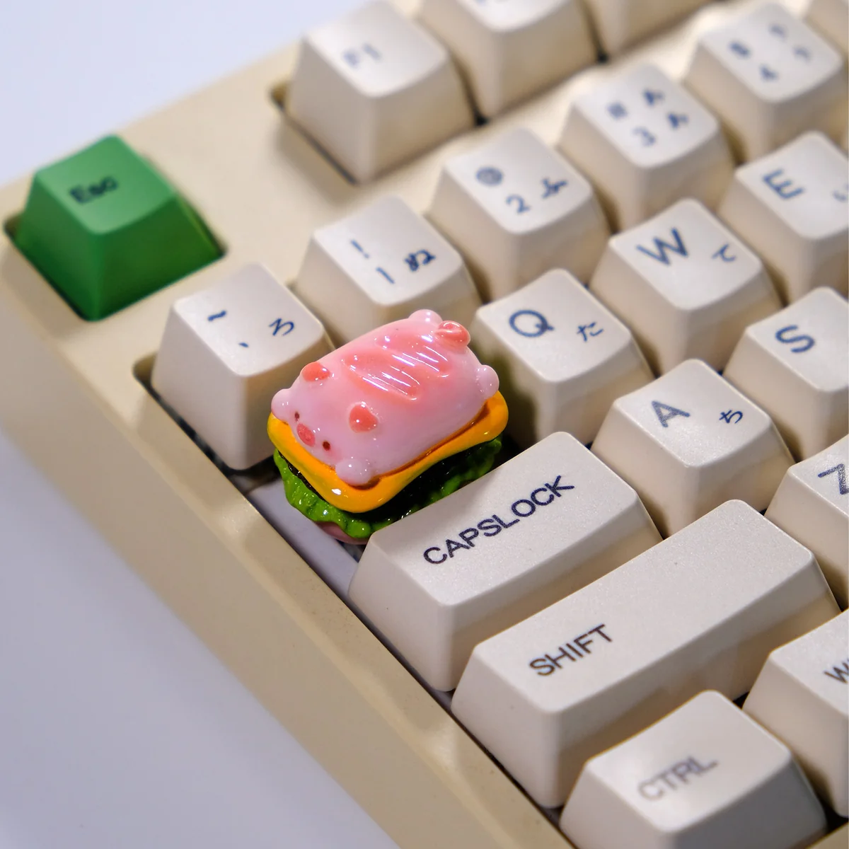 A whimsical pink Pig Pie handcrafted 3D artisan keycap, featuring a glossy food-inspired design for unique mechanical keyboards.