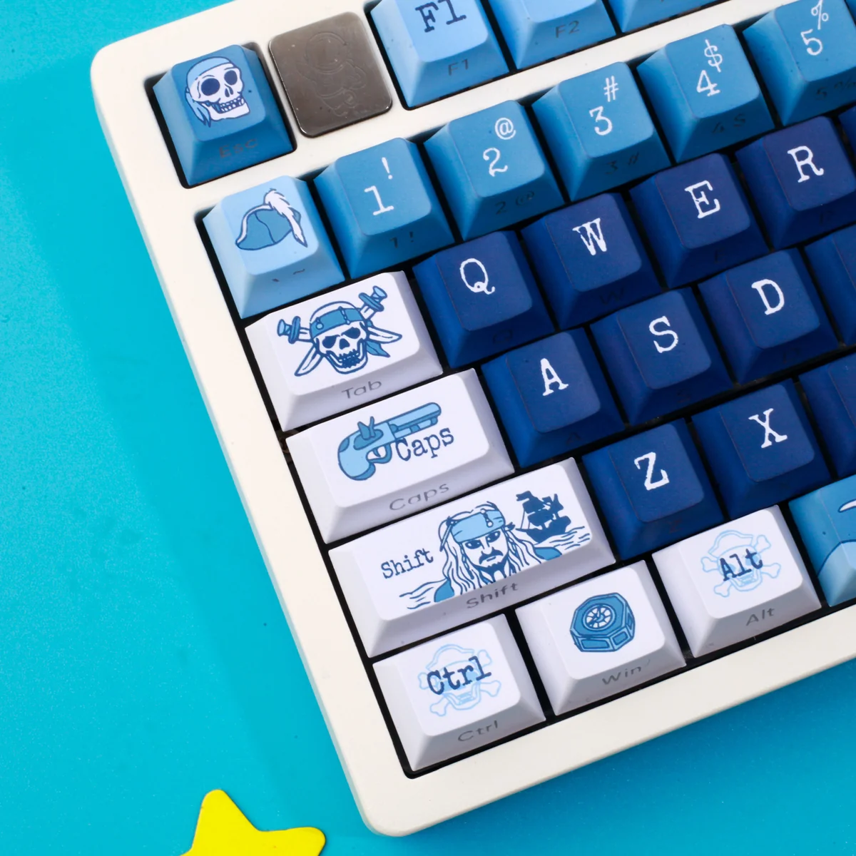 A playful collection of durable PBT Pirate Keycaps Set in swashbuckling blue and white, showcasing their unique profile from various angles for a vibrant design.