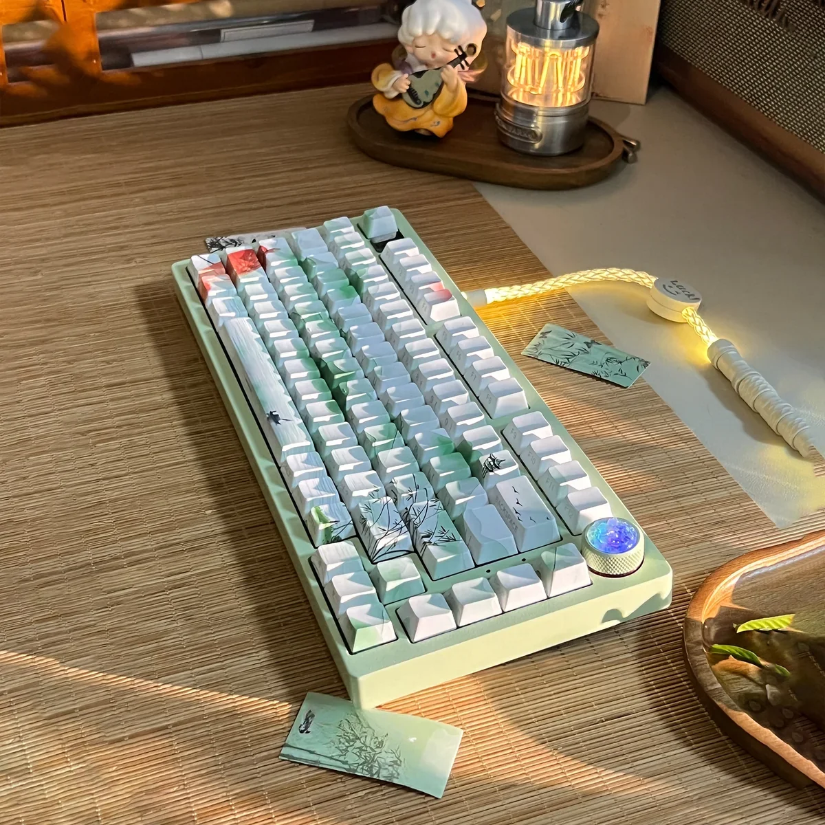 Close-up views of the Poetic Chinese Landscape PBT Keycap Set, showcasing serene ink wash art and traditional motifs from multiple angles.