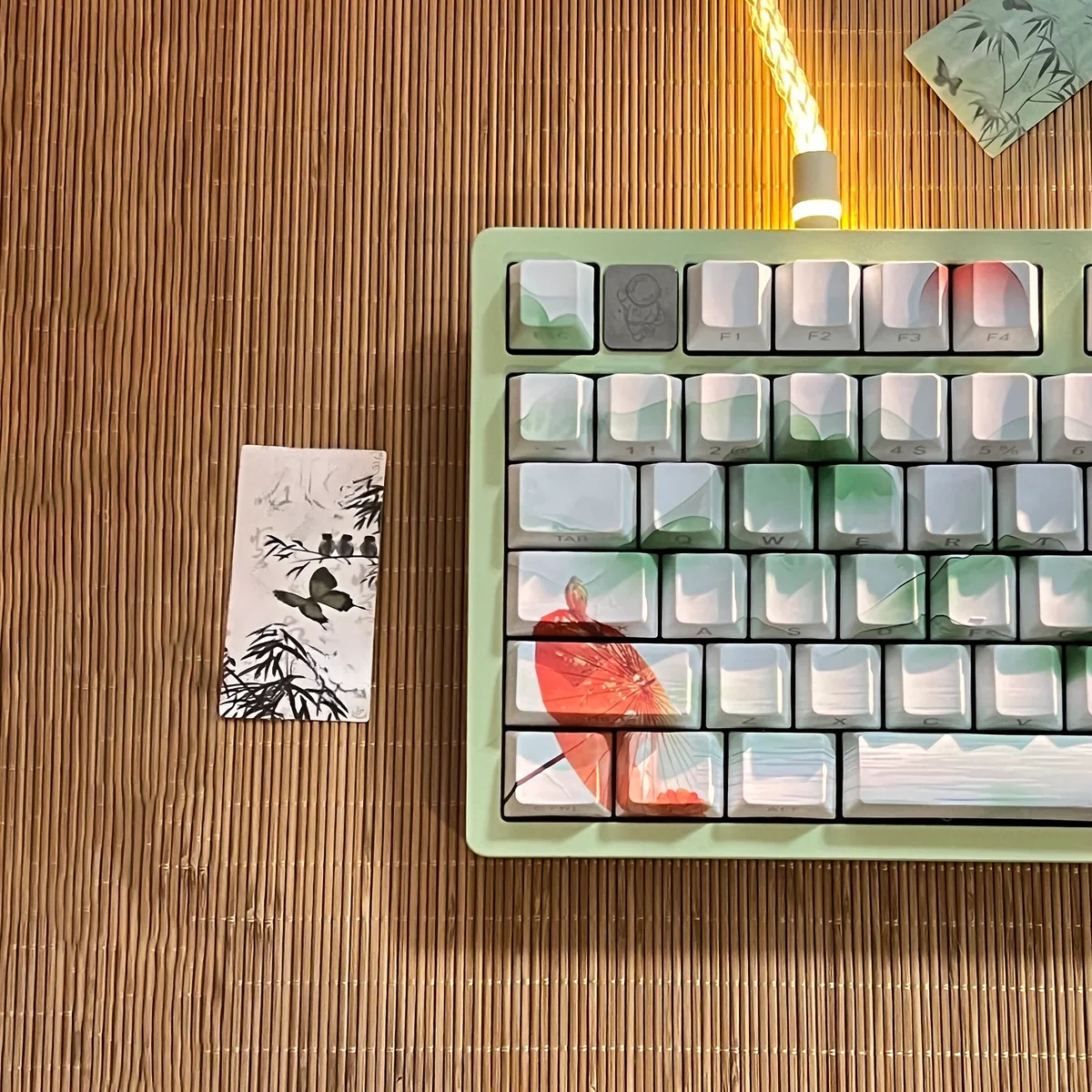 Close-up views of the Poetic Chinese Landscape PBT keycap set, showcasing intricate ink wash art and traditional motifs. Each keycap exudes serene.